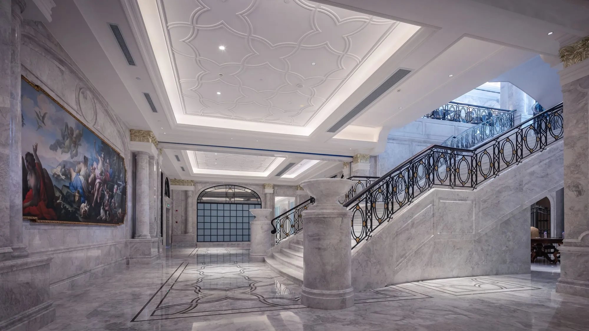 Grand marble entrance hall with a sweeping staircase