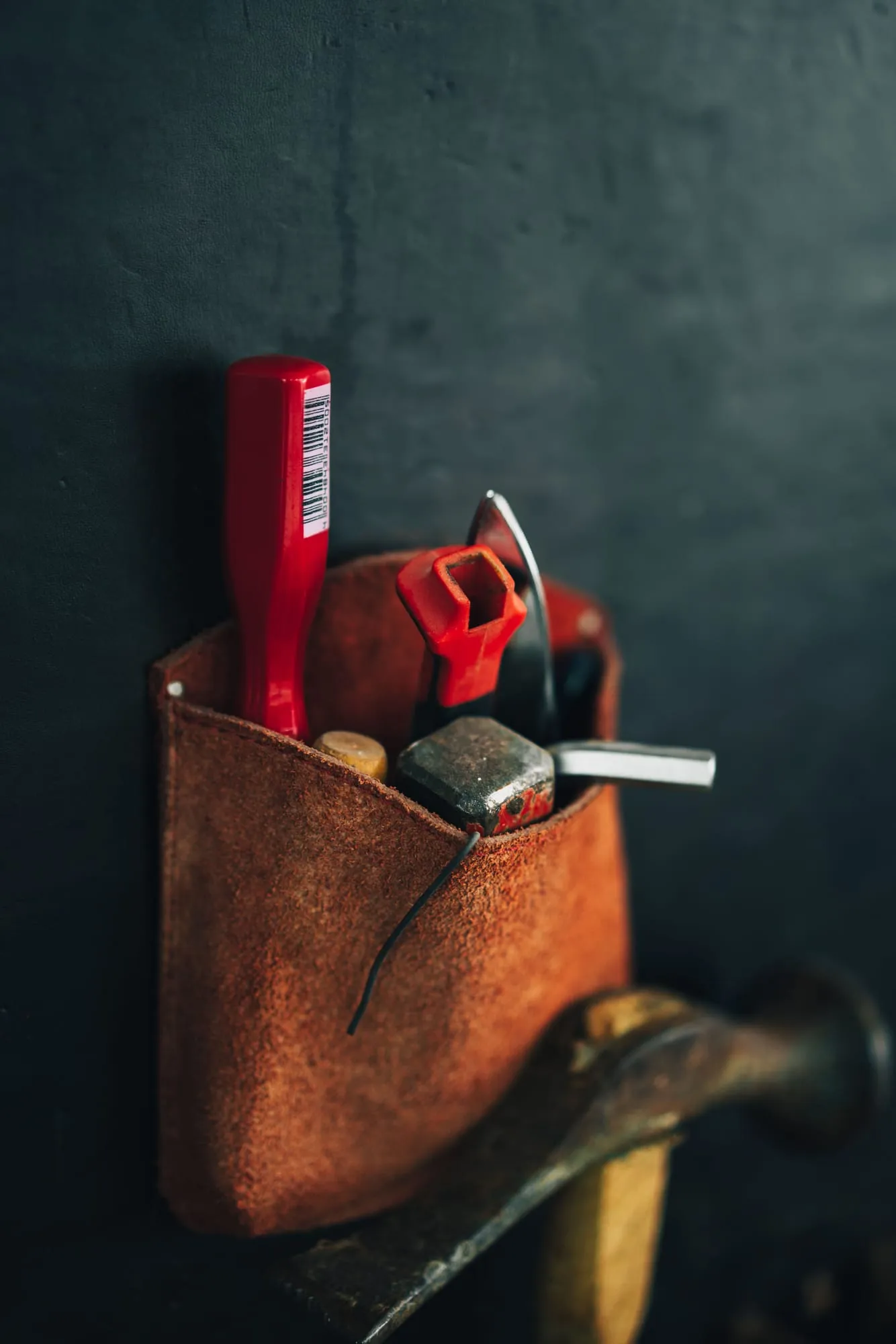 Tool pouch with hammer and pliers