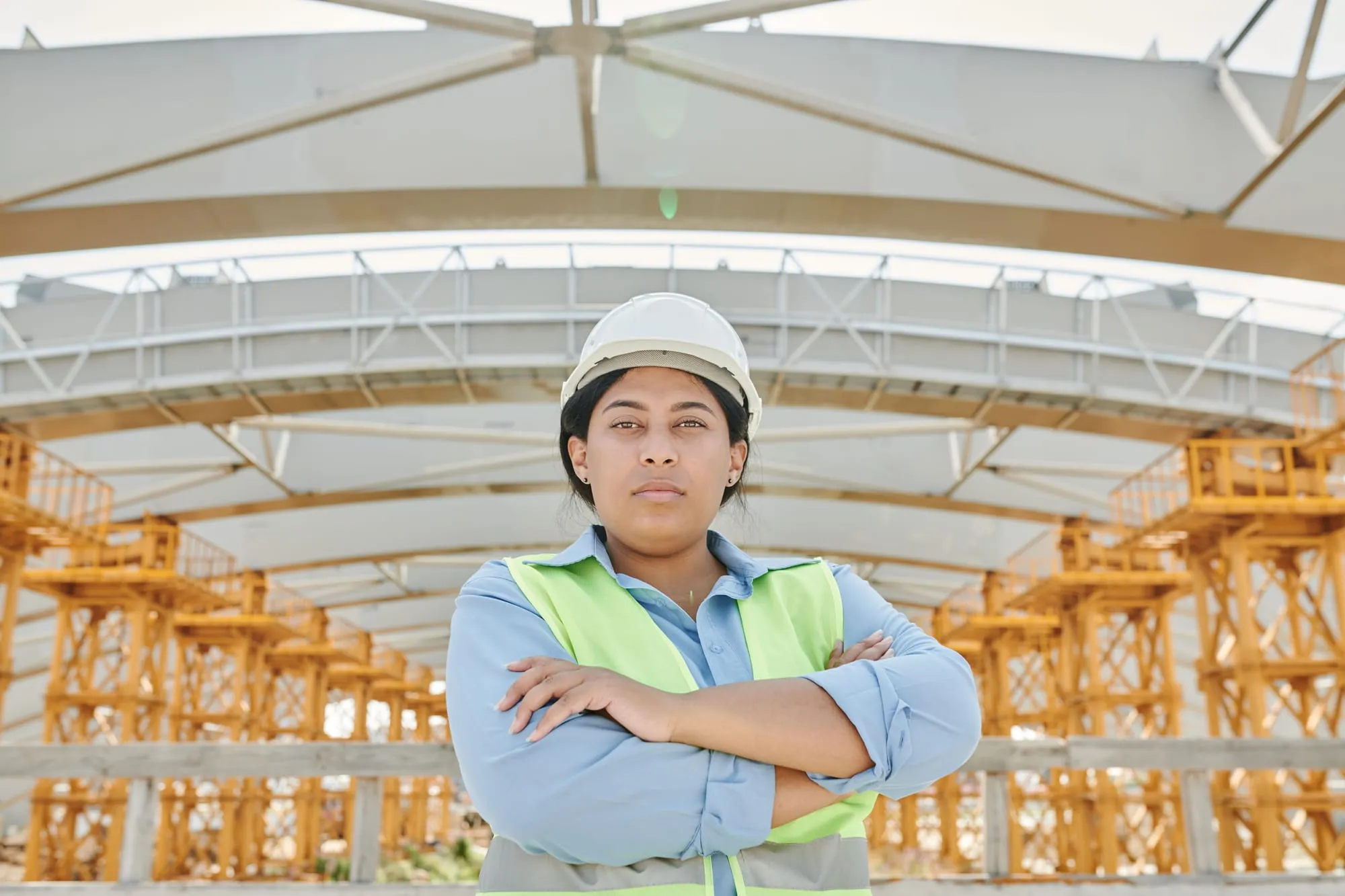 Site engineer in high-visibility vest and hard hat
