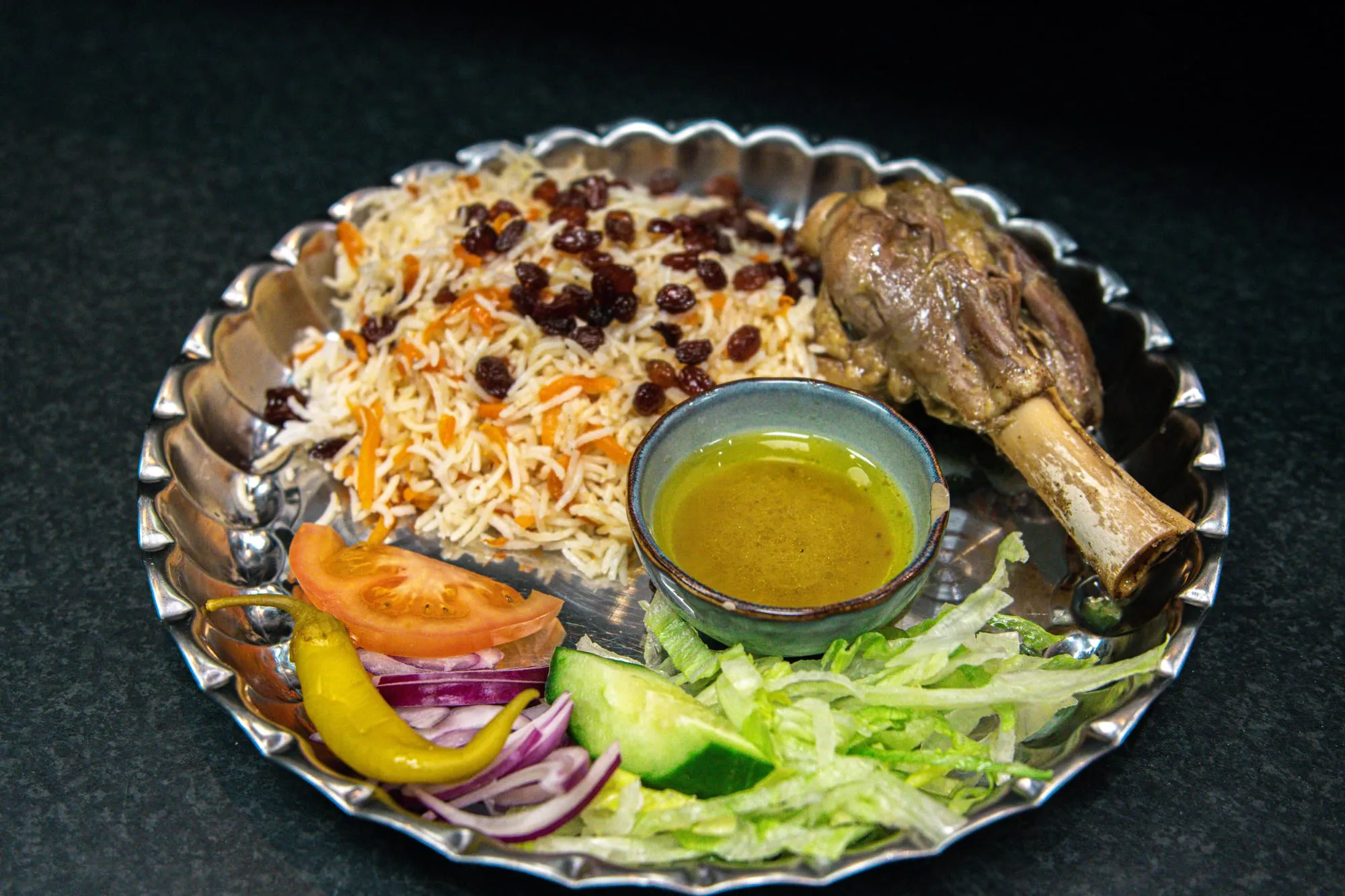 Slow-cooked lamb shank over saffron rice