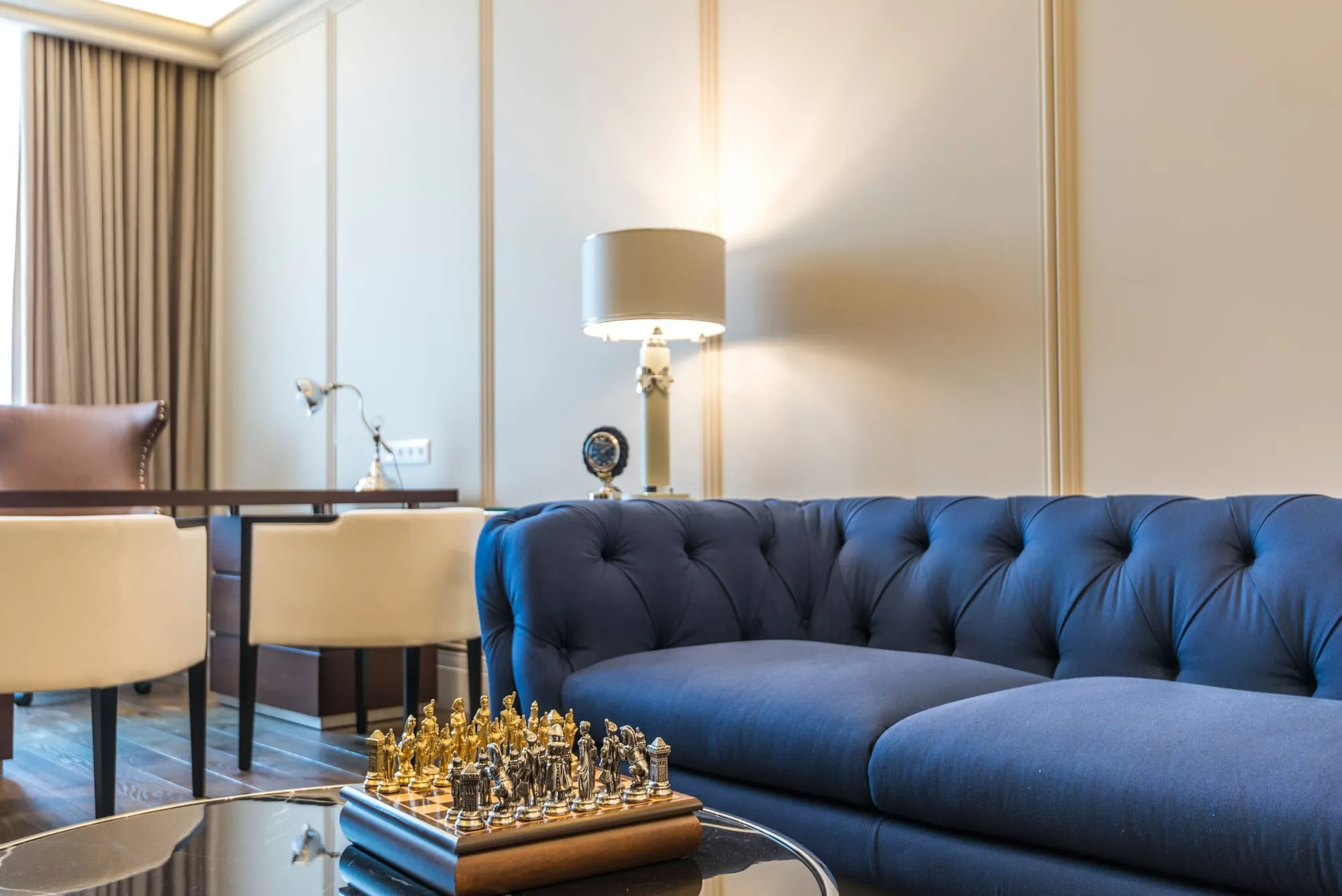 Living room with a velvet sofa and warm lighting