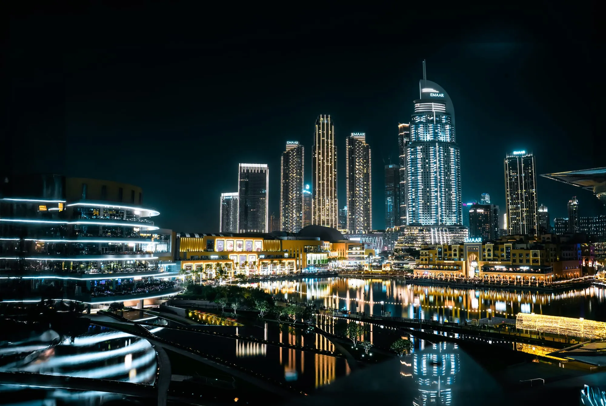 Dubai Marina towers reflected in the water at night
