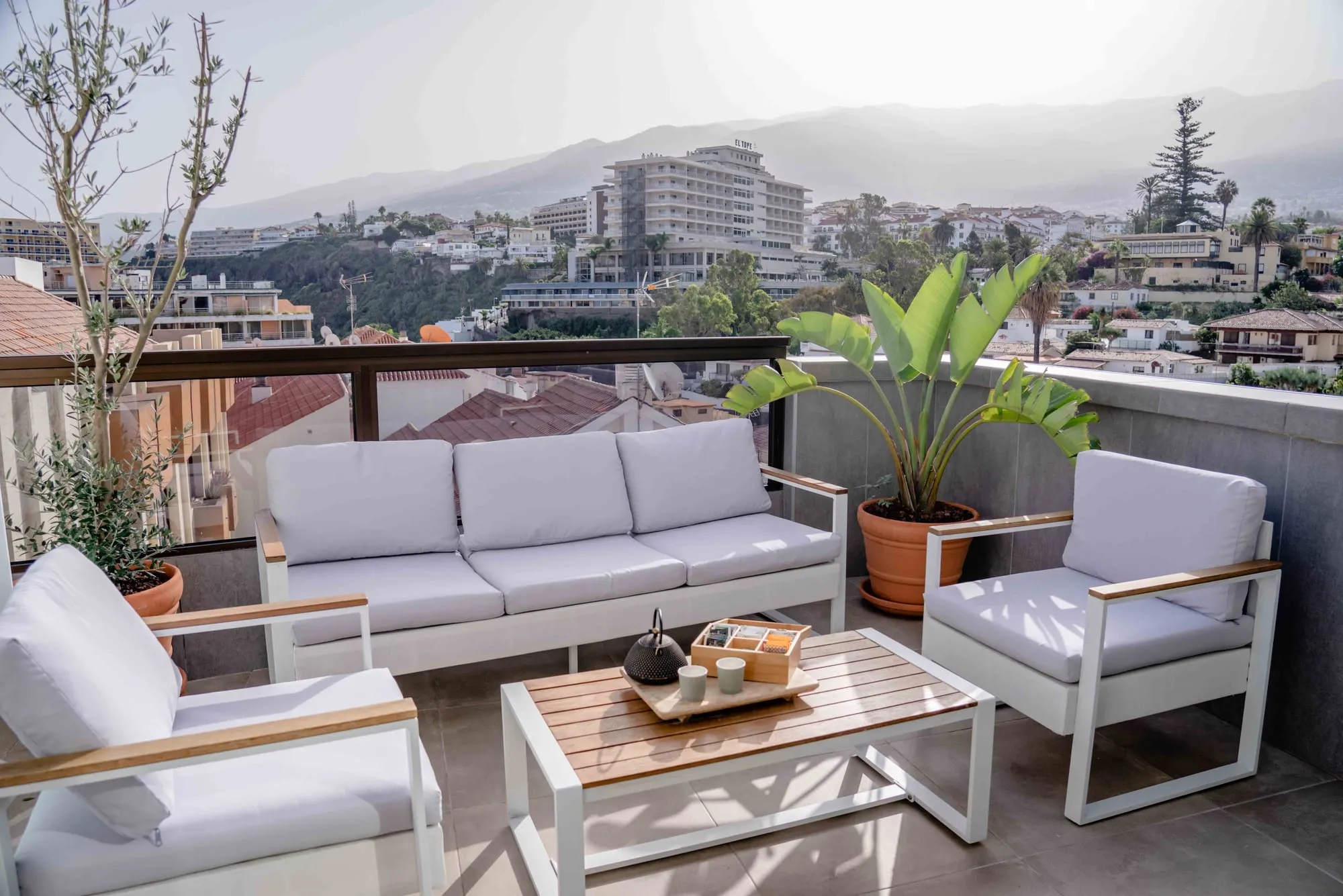 Penthouse terrace with outdoor lounge and city views